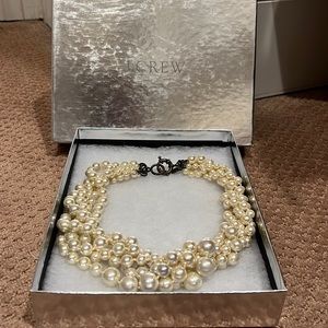 Give strands pearl necklace .